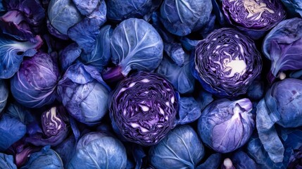 Obraz premium Close-up top view of fresh blue cabbage texture in the cut featuring vibrant purple tones and organic raw vegetable patterns ideal for healthy food backgrounds, culinary design concepts, and natural p