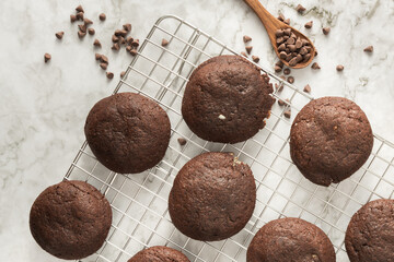 Homemade baked chocolate brownie cookies from above against a white background.