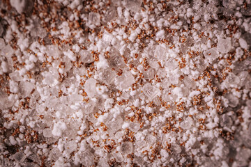 Macro shot of granulated instant coffee mix featuring sugar, milk powder, and coffee crystals....