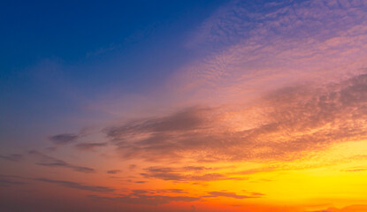 Orange sky and clouds background,Beautiful Vivid sky painted by the sun leaving bright golden shades