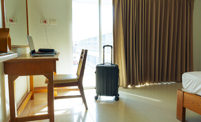 Luggage in hotel room,Plastic hard shell luggage with extended telescopic handle,Inter views of modern hotel room