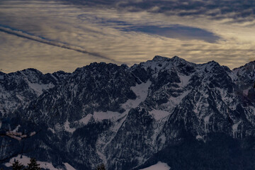 Clouds at sunset over the rocky peaks of the Zahmer Kaiser (Kaiser Mountains, Tyrol, Austria)
