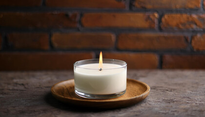 Natural soy wax candle in glass jar on wooden table. Cozy home decor. Aromatherapy, spa, meditation