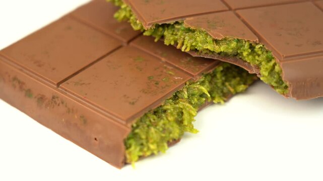 Dubai chocolate bar with green pistachio nuts kadaif dessert.