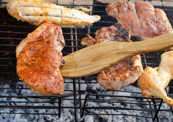 Juicy meat cooked on the grill over an open fire