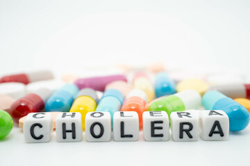 Cholera word with pills and capsules medical drug.