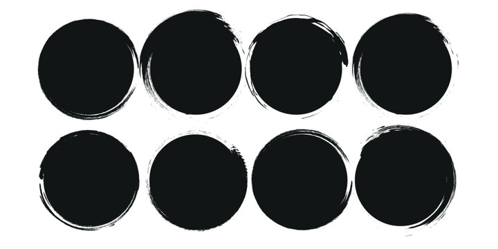 A collection of black grunge circular shapes on a white background, featuring paintbrush style stamps. Includes vector brush circles and distressed round designs. ink brush ellipse circle shape vector