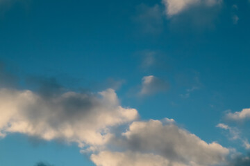 Winter blue sky and cloud. Calm clear winter air background. The sky blue texture clouds. Blue sky and White cloud nature background.