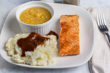 baked seasoned salmon  with corn  and mashed potatoes