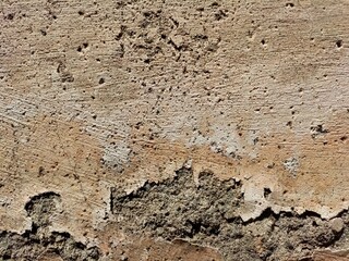 Cracked concrete wall covered with gray cement surface as background, abstract, grunge