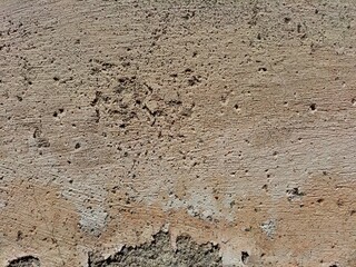 Cracked concrete wall covered with gray cement surface as background, abstract, grunge