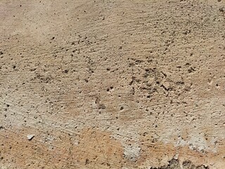 Cracked concrete wall covered with gray cement surface as background, abstract, grunge