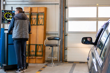 Inspection lane in car technical control station. Annual vehicle inspection before the car registration. Automotive safety concept.