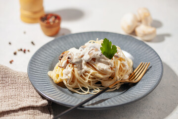 Spaghetti pasta with mushroom white cream sauce.  Italian food style