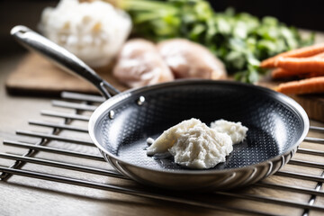 Pork lard in a non-stick cast iron pan.