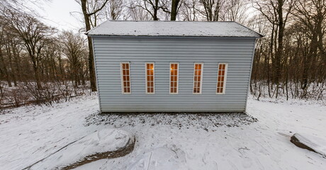 A beautiful and small minimalist house in the middle of a forest during winter. The perfect retreat...