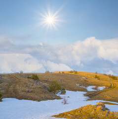 winter snowbound mountain ridge under a sparkle sun