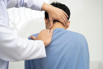 Physical therapy, Asian therapist doctor treat perform pain young man in hospital.