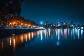 Cityscape reflecting on water at night with street lights and trees