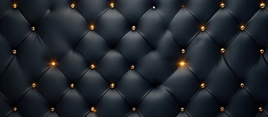 Elegant and luxurious button tufted leather upholstery texture with metallic gold brass or copper accents in a dark moody and dramatic lighting setup  This high end sophisticated