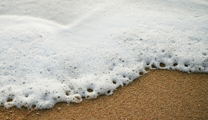 sand and waves on sea for abstract background.