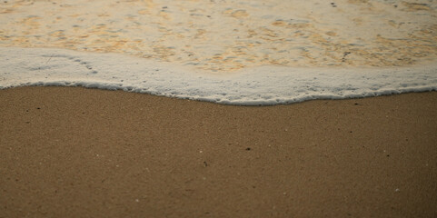 sand and waves on sea for abstract background.