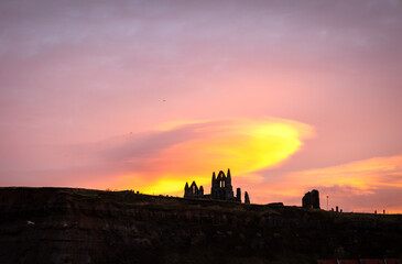 Obraz premium Dramatic clouds and sky above Whitby Abbey
