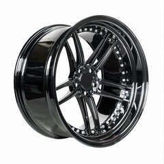 Obraz premium Stylish black alloy wheel rim rotating on white background, perfect for showcasing car tuning and customization