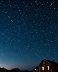 Fototapeta premium Serene night scene featuring a cozy cabin illuminated under a breathtaking starry sky, with shooting stars streaking across the vast expanse.