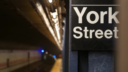 New York City empty subway station interior, underground metropolitan platform sign. Metro railway...