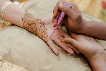Beautiful henna art design on hands featuring intricate traditional mehndi patterns for weddings,...
