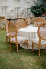 Wedding reception, table setting and celebration event with flower arrangement, decor and catering for a romantic setting. Party, luxury restaurant or fancy place with cutlery