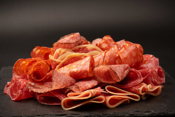 Different kinds of meat cuts on a board.