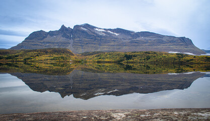 An island in the Lofoten archipelago is beautifully reflected