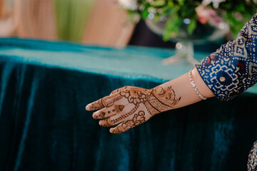 Beautiful henna art design on hands featuring intricate traditional mehndi patterns for weddings,...