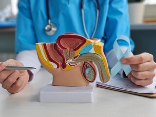 Blue November, prostate cancer awareness month doctor with blue ribbon in hospital to support people