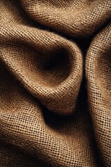 macro view of organic jute fabric in natural brown tone with rough fibers and ample copy space