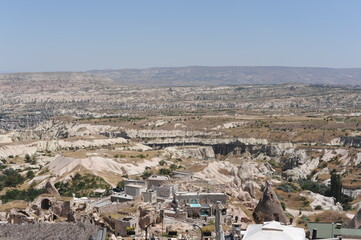 Fototapeta premium Ancient town of Uchisar with caves in the rocks and a castle in Nevsehir province, Cappadocia, Anatolia, Turkey