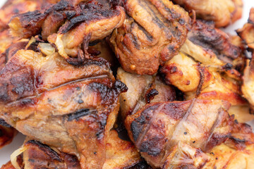 
Close-up of delicious grilled chicken pieces looking juicy and delicious.
