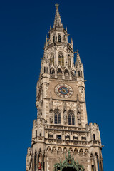 Fototapeta premium New Town Hall of Munich with blue sky. Neue Rathaus, famous neo-Gothic style palace in Marienplatz, in town square in historic center. Germany Bavaria