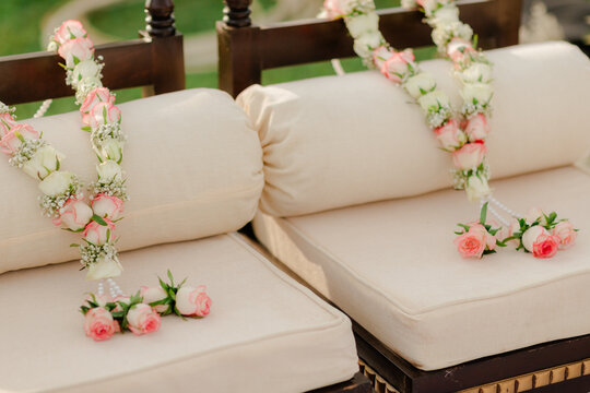 A traditional Indian jaimala ceremony, where the bride and groom exchange floral garlands, symbolizing acceptance and the beginning of their sacred marital journey