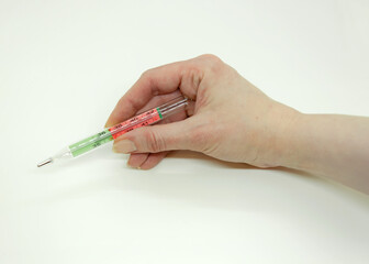 Female hand holding thermometer on white background