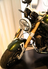 close-up of the front of the motorcycle. The central place is occupied by a round headlight...