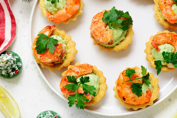Tartlets with cream cheese, avocado and shrimps..top view.style hugge