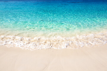 Beautiful white sand beach with turquoise water on a sunny day in Similan Islands near Phuket, Thailand.