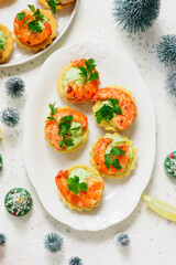 Tartlets with cream cheese, avocado and shrimps..top view.style hugge
