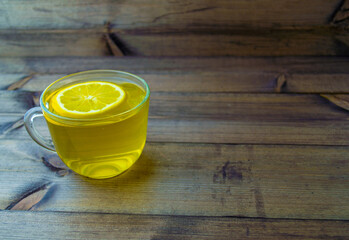 Green tea with lemon in a mug.
