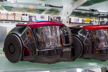 Obraz premium A showcase with vacuum cleaners. A home appliance store selling electrical equipment.