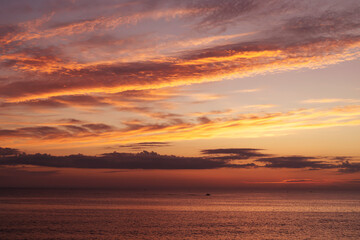 Sunset in the sea in orange tones, Sardinia