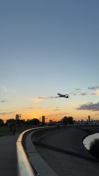 Evening traffic and taking off plane on the sunset from Jorge Newberry airport in Buenos Aires, Argentina